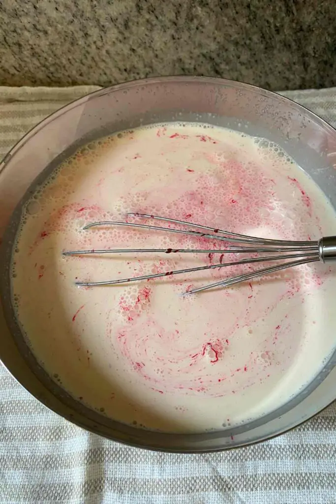 Adding pink food coloring to Rose Ice Cream base