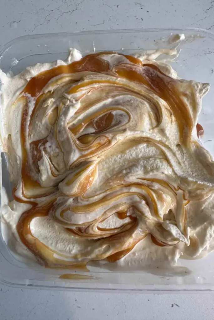 Adding caramel to the apple ice cream